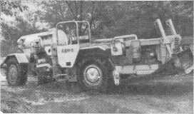 Строительно-дорожная машина для строительства дорог в подземных выработках рудника .